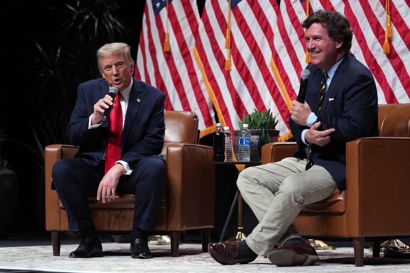 Republican presidential nominee former President Donald Trump speaks with Tucker Carlson during a Tucker Carlson Live Tour show at Desert Diamond Arena, Thursday, Oct. 31, 2024, in Glendale, Ariz. (AP Photo/Julia Demaree Nikhinson)