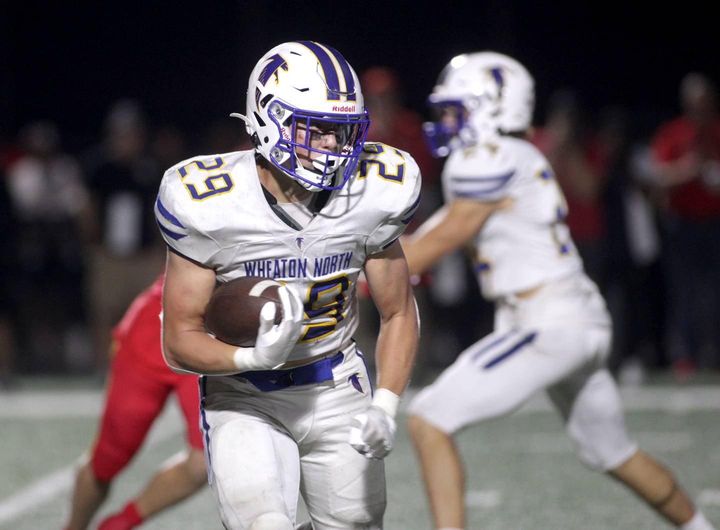 Wheaton North’s Walker Owens carries the ball during a game at Batavia on Friday, Sept. 22, 2023.