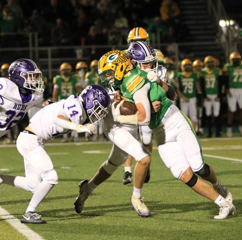 Rochelle's Mark Green (14) gets in on a tackle of a Geneseo player during Friday's Class 4A first-round game at Geneseo.