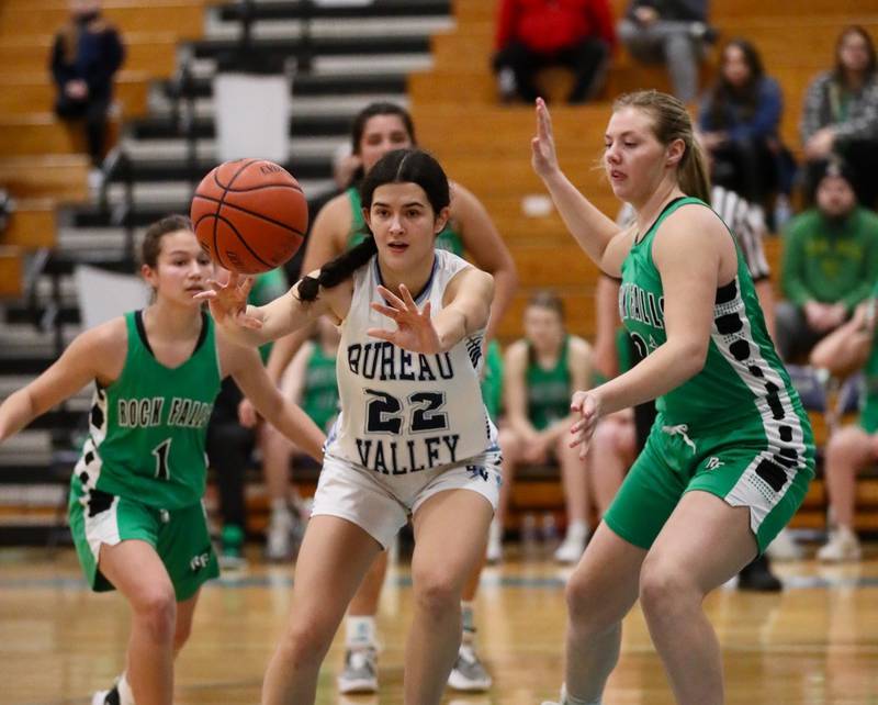 Bureau Valley junior Izzy Birkey passes out of a crowd in Saturday's regional game at the Storm Cellar against Rock Falls.