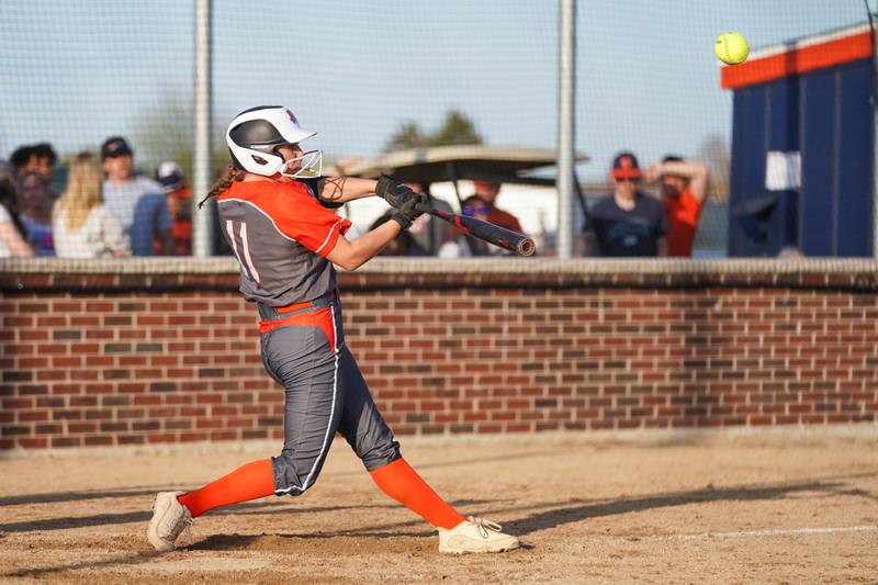 Minooka’s Karli McMillin (11) drives in a run off of a sacrifice fly during a Southwest Prairie Conference softball game against Oswego at Oswego High School on Wednesday, April 23, 2025.