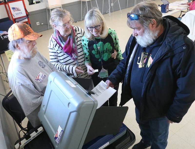 Election judges (from left) Mike Gage, Amy Conrad and LuAnne Carretto help Kevin Katrein cast his ballot on Tuesday, March 17, 2026 at the Ottawa Lions Club.