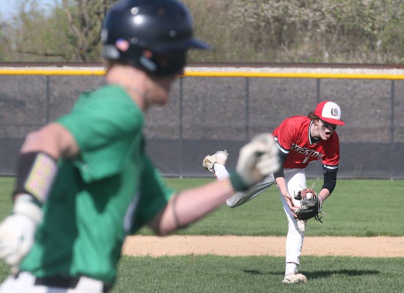 Streator's Blaize Bressner fields a ground ball as Seneca's Kenny Daggett runs to first base on Friday, April 19, 2024 at Seneca High School.