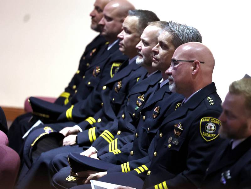 Law enforcement officers listen during the memorial service for DeKalb County Sheriff Roger Scott Friday, March 7, 2025, at Bethany Road Bible Church in DeKalb. Scott, who was the county sheriff for 36 years, died on February 23 at the age of 78.