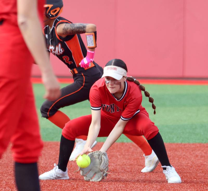 Huntley’s Aubrina Adamik scoops up a grounder against DeKalb in IHSA Class 4A Sectional Semifinal softball action at Barrington High School in Barrington on Wednesday, June 4, 2025.