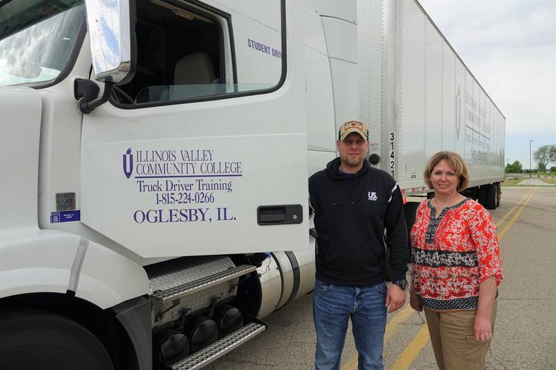 Illinois Valley Community College's 2,000th Truck Driver Training graduate Alec Sramek with administrative assistant Audrey Moreno.