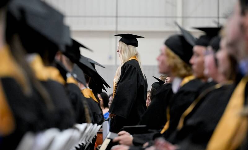 Graduates process up to receive their diplomas during the 2024 Sycamore High School commencement in Sycamore on Sunday, May 26, 2024.