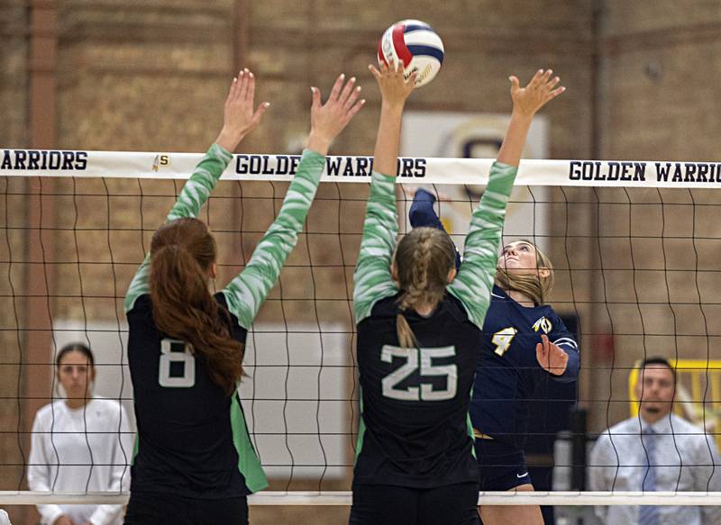 Sterling’s Olivia Melcher plays a shot works the net against Alleman’s Emilye Polich (left) and Megan Hulke Monday, Sept. 18, 2023 at Sterling High School.