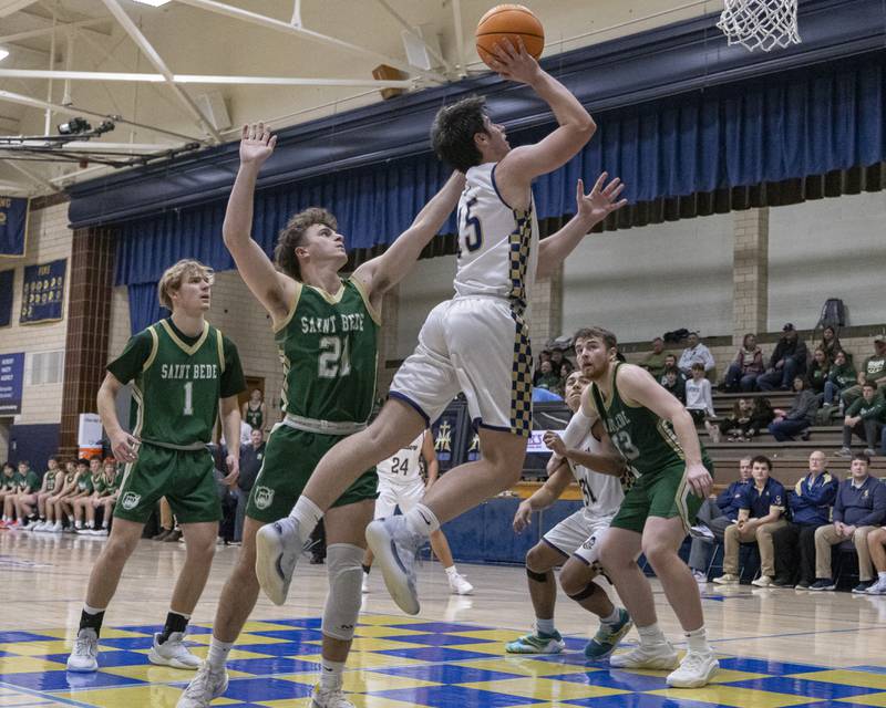 Alec Novotney of Marquette shoots a layup against St. Bede during the game on January 10, 2025 at Marquette Academy.