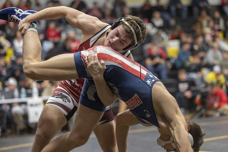 Erie’s Tristan Hovey works on the leg of Morrison’s Caleb Modglin in the 150 pound finals Saturday, Jan. 31, 2026, during the Class 1A Wrestling Regionals at Riverdale High School. Modglin won 9-6.