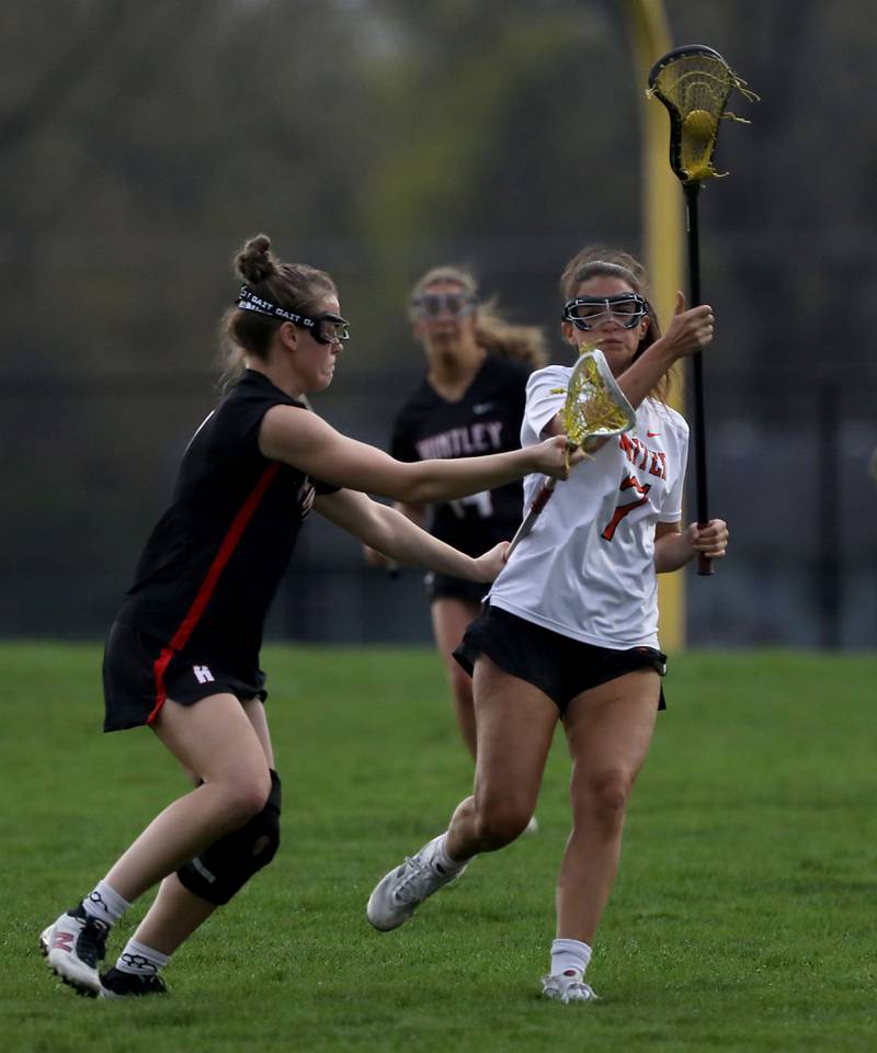 Huntley's Aubrie Rohrbacher guards Crystal Lake Central co-op's Adaline Arliskas during a Fox Valley Conference girls lacrosse match on Friday, April 17, 2026, at Crystal Lake Central High School.