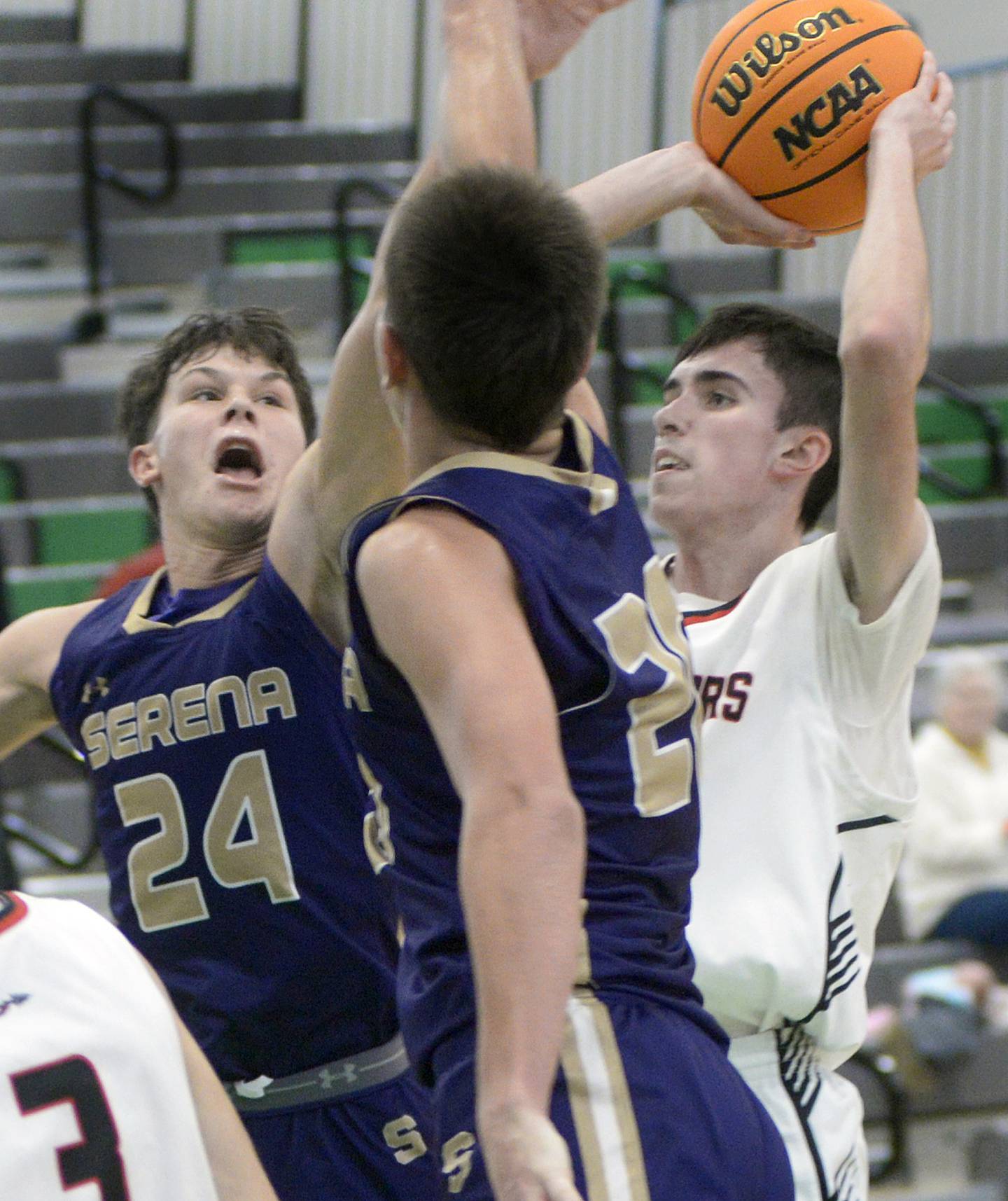 Serena’s Payton Twait and Beau Raikes work to block a shot by Woodland’s Nick Plesko in the first period Thursday during the Shipyard Showdown Tournament at Seneca.