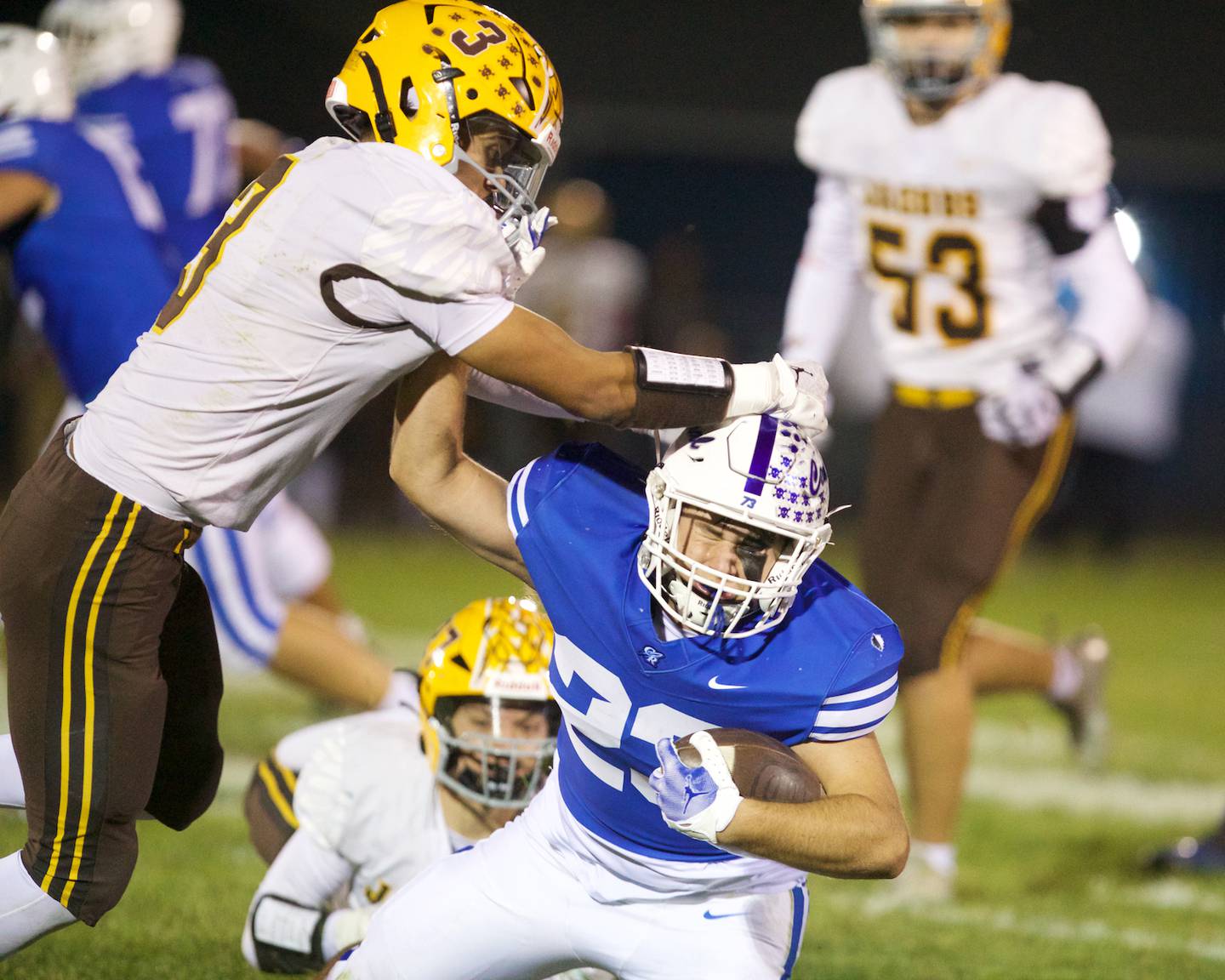 Burlington Central's Zachary Samaan is tackled by Jacobs' Owen Hoffman on Friday, October 4,2024 in Burlington.