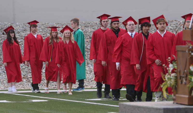 La Salle-Peru Township High School graduates walk to receive their diplomas during the L-P Class of 2026 commencement ceremony on Thursday, May 14, 2026 at Howard Fellows Stadium.