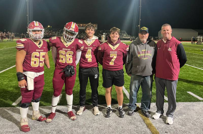Dave Carr, gray hoodie, a 1985 Morris graduate and Navy veteran, has been a long time volunteer for the Morris basketball and football programs.