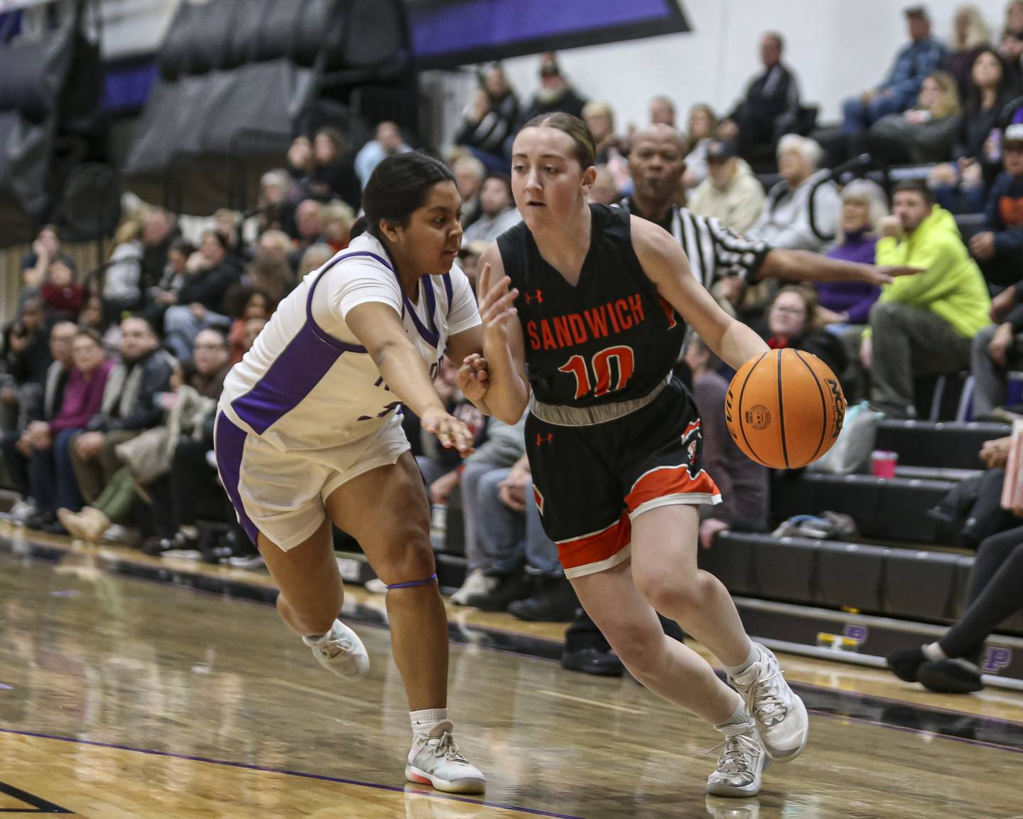 Sandwich's Kayden Corneils (10) drives baseline during their basketball game between Sandwich at Plano Tuesday Dec 2, in Plano.