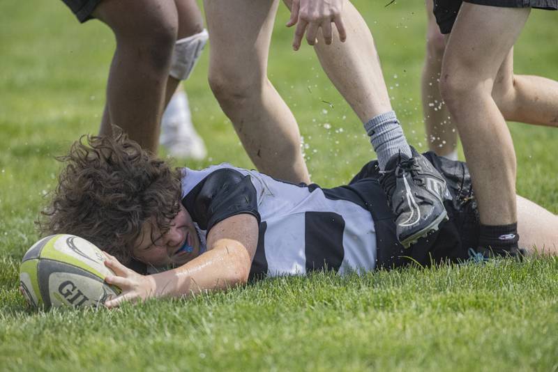 Will smith of the West Suburban Barbarians fights to maintain possession of the ball during the rugby game at Veteran's Park on April 28, 2024.