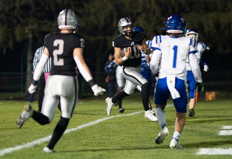 Kaneland’s Troyer Carlson (10) scores a touchdown on a keeper against Riverside Brookfield during a 6A playoff football game at Kaneland High School in Maple Park on Friday, Oct 28, 2022.