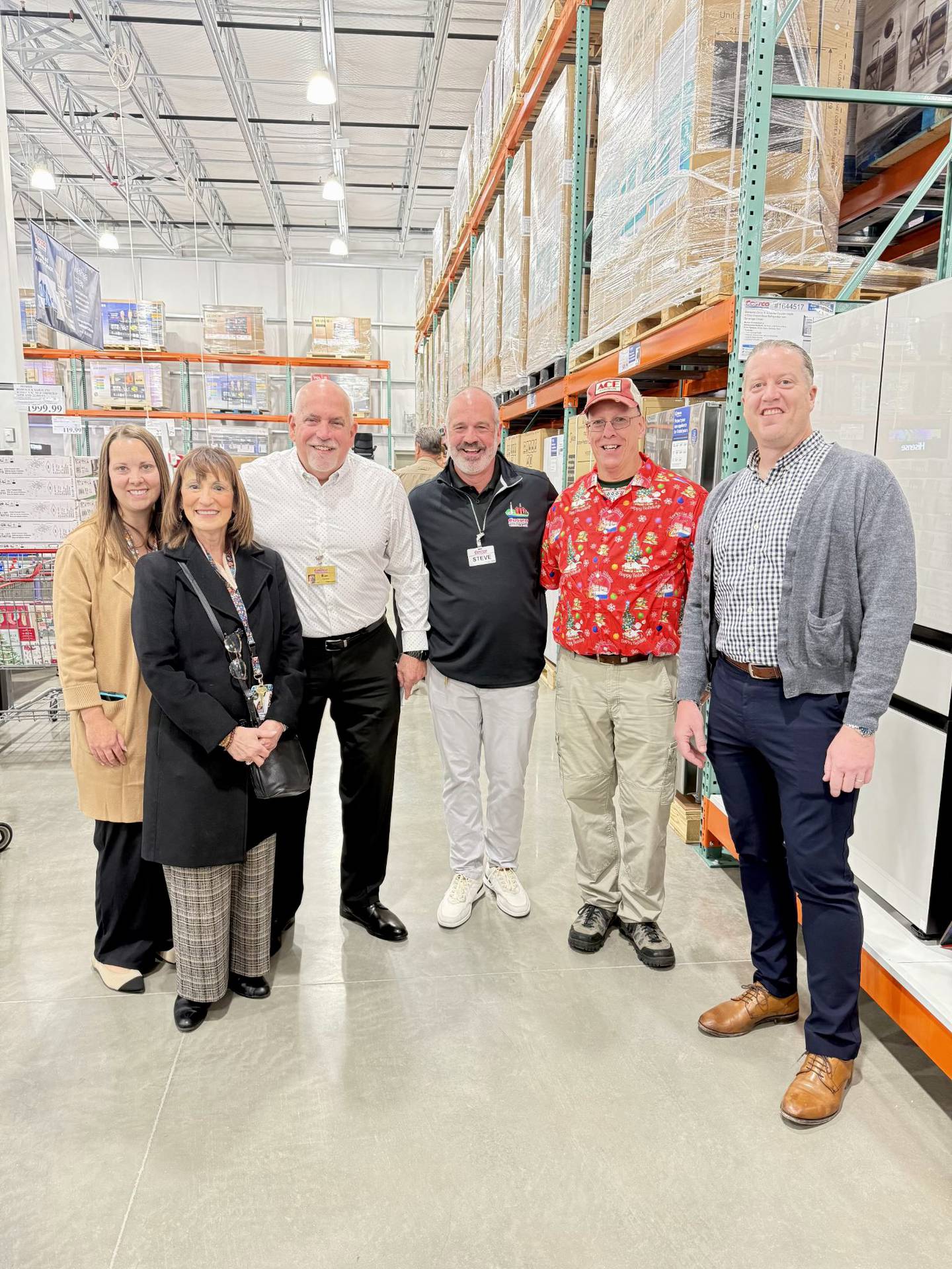 The Costco CEO joins Yorkville city staff to celebrate the Costco Yorkville grand opening on Nov. 12, 2025. Pictured, Katelyn Gregory and Lynn Dubajic Kellogg of Yorkville's economic development committee. Costco CEO Ron Vachris and Costco Yorkville general manager Steve Ftacek. Also pictured, Yorkville mayor John Purcell and Yorkville city administrator Bart Olson.