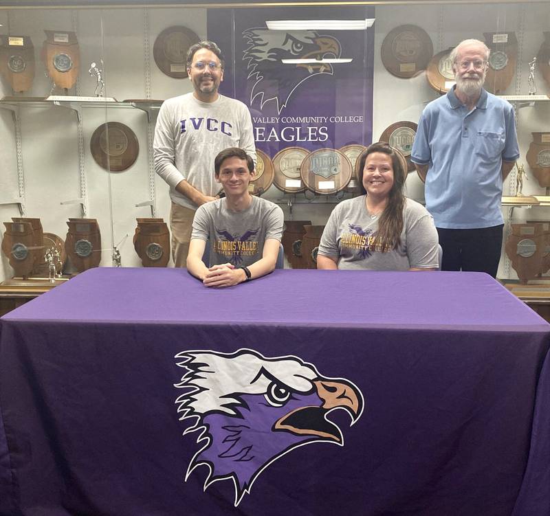 Princeton grad Christian Yepsen (front, left) became the first runner to sign with the new IVCC cross country program. He's joined by his mother, Christie Jo Vorhies and (back row), IVCC coach Matt Baker and PHS coach Pat Hodge.