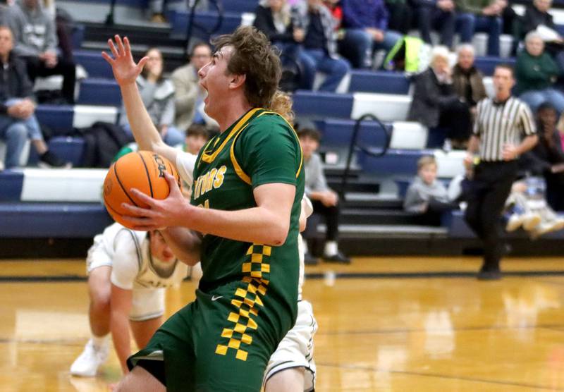 Crystal Lake South’s  Ryan Morgan works under the hoop in varsity boys basketball on Wednesday, Dec. 3, 2025, at Cary-Grove High School in Cary.