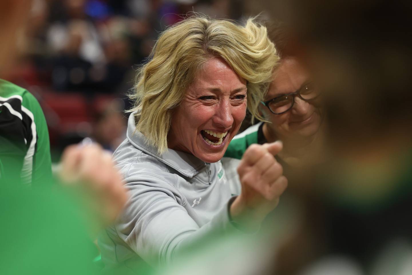 An emotional Shelia Pillars pumps her first after giving a speak as her last game as head coach for Rock Falls after the Rockets win against Carmi-White County in the Class 2A Volleyball Third Place match on Saturday, Nov. 11, 2023 in Normal.