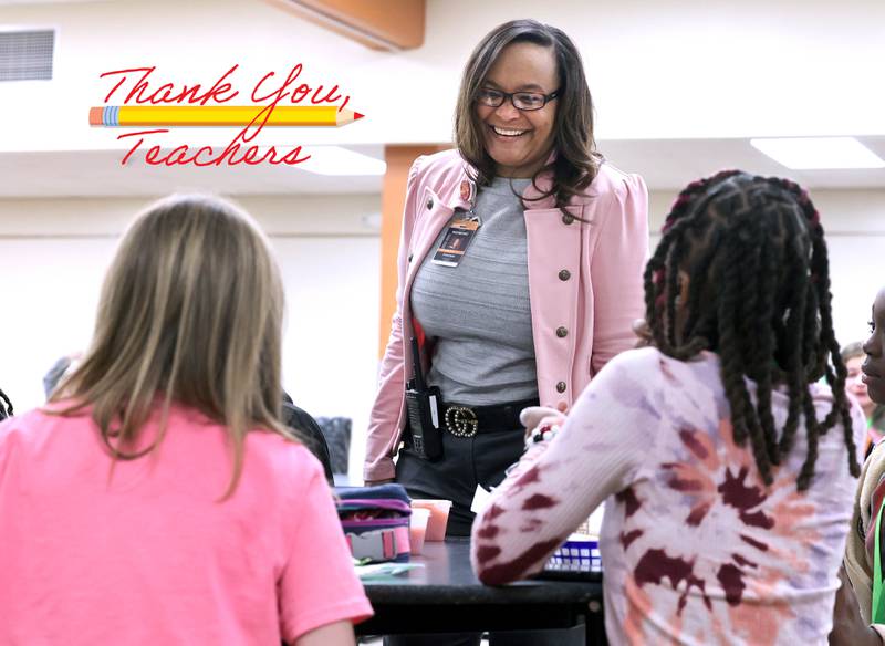 Treveda Redmond, principal at Huntley Middle School, has a laugh with sixth-grade students during lunch Tuesday, March 14, 2023, at the school in DeKalb.
