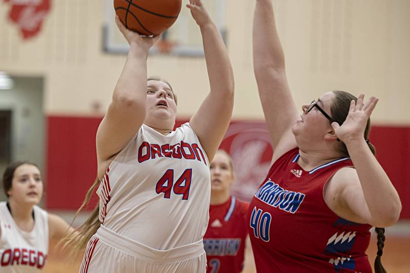 Oregon’s Noelle Girton puts up a shot over Morrison’s Sarah Weston Wednesday, Jan. 17, 2024 at Oregon High School.