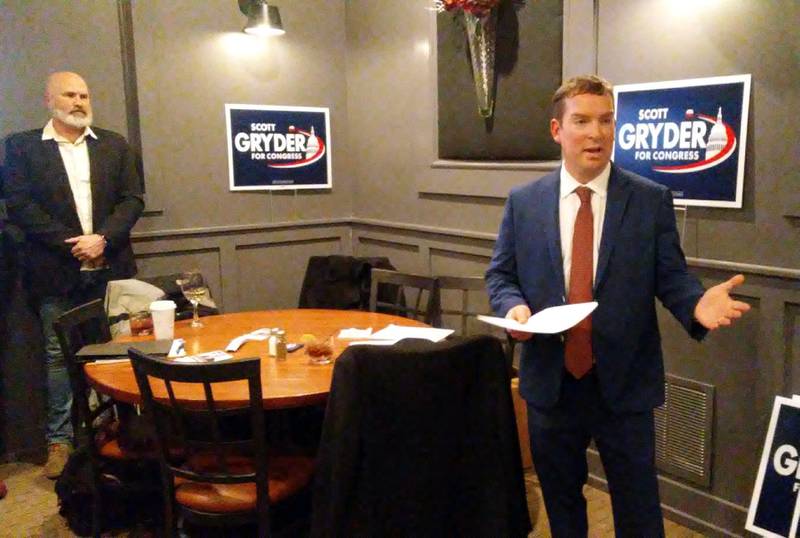 Kendall County Board Chairman Scott Gryder announces his candidacy for the 14th Congressional District seat as Sheriff Dwight Baird looks on, at a reception on Feb. 24 at a Yorkville restaurant.