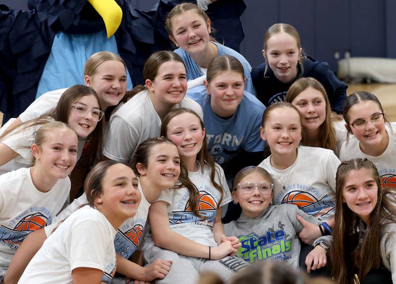 Members of the Bureau Valley Storm seventh-grade girls basketball team pose for a photo during a prep rally on Thursday, Dec. 11, 2025 at Bureau Valley High School in Manlius. The Storm (23-1) will meet undefeated Mt. Sterling Brown County (25-0) for the IESA Class 2A state title at 7:30 p.m tonight.