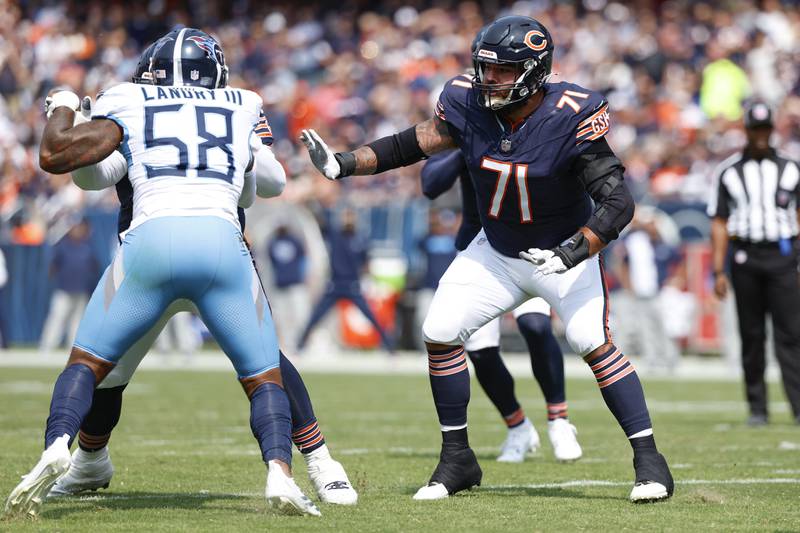 Chicago Bears center Ryan Bates (71) blocks against Tennessee Titans linebacker Harold Landry III (58) during the first half of an NFL football game in September in Chicago. The Bears defeated the Titans 24-17.