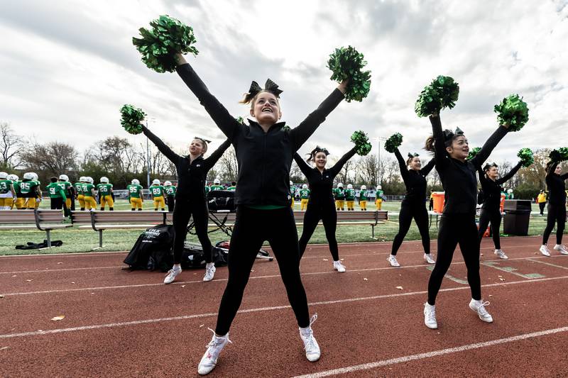 Providence’s varsity cheer team shares school spirit during a 5A varsity football playoff game against Washington at Providence on Nov. 15, 2025.
