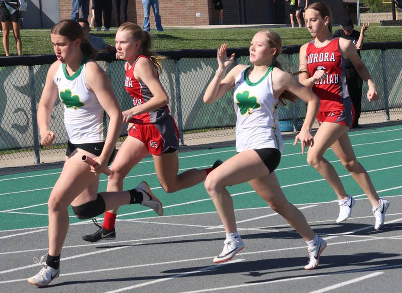 Seneca's Vilot Mauer and Alise Jackson run the 4x100 relay with Aurora Christian's Grace Knight and Medrano Genevieve during the Class 1A Sectional meet on Thursday, May 14, 2026 at Seneca High School.