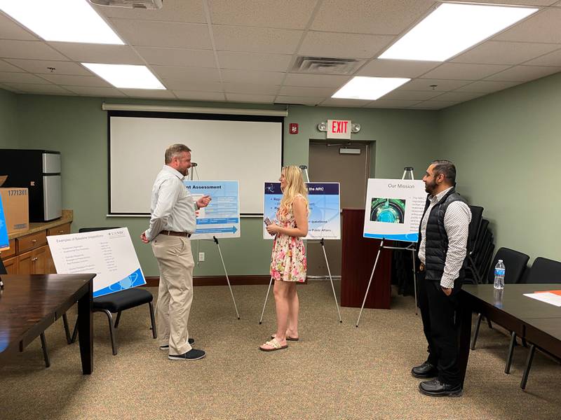 Jakob Steffes (left) explains the processes behind inspecting Dresden nuclear plant.