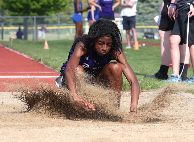 Plano’s Luniah Gilford participates in the long jump Wednesday, May 8, 2024, during the girls track Class 2A sectional at Rochelle High School.