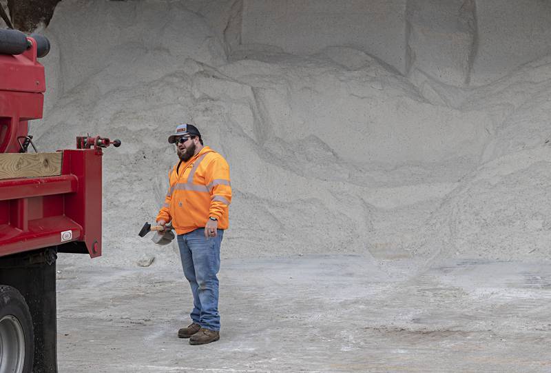 Everett Dearing works at a street department salt dome Monday, Jan. 8, 2024 as the Dixon street department prepares for a substantial snow fall.