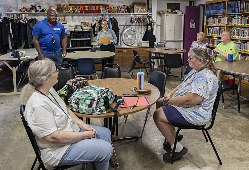 Jacob Jenkins (left) and Cecilia Maciel Martinez, volunteer program coordinators with Serve Illinois presents recognition certificates to the the volunteers Tuesday, Sept. 26, 2023 at Teen Turn in Amboy.