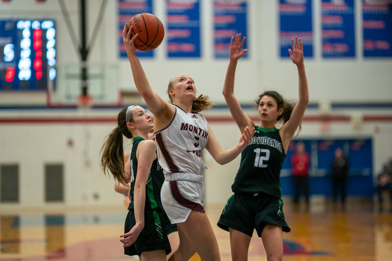Montini's Victoria Matulevicius (5) shoots the ball in the post against Providence's Molly Knight (10) during the 3A Glenbard South Sectional basketball final at Glenbard South High School in Glen Ellyn on Thursday, Feb 23, 2023.