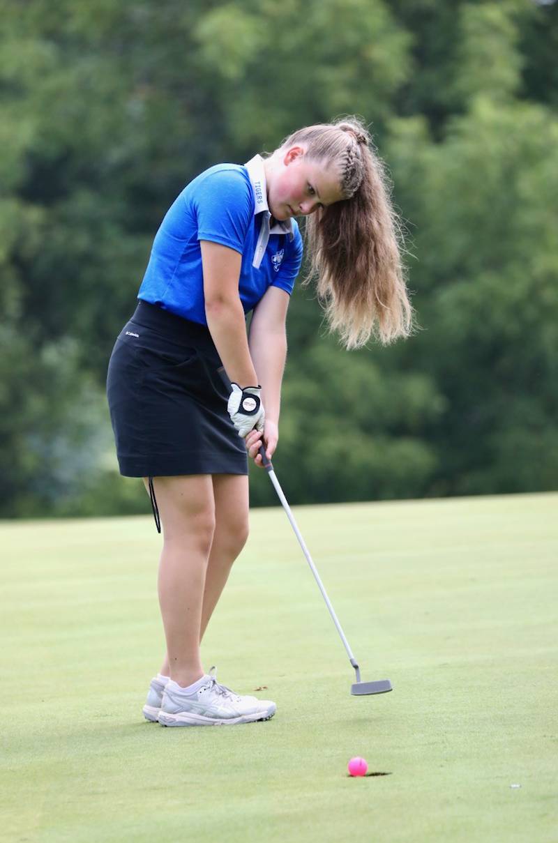 Princeton's Brinley Kloepping taps in a putt Saturday at Wyaton Hills.