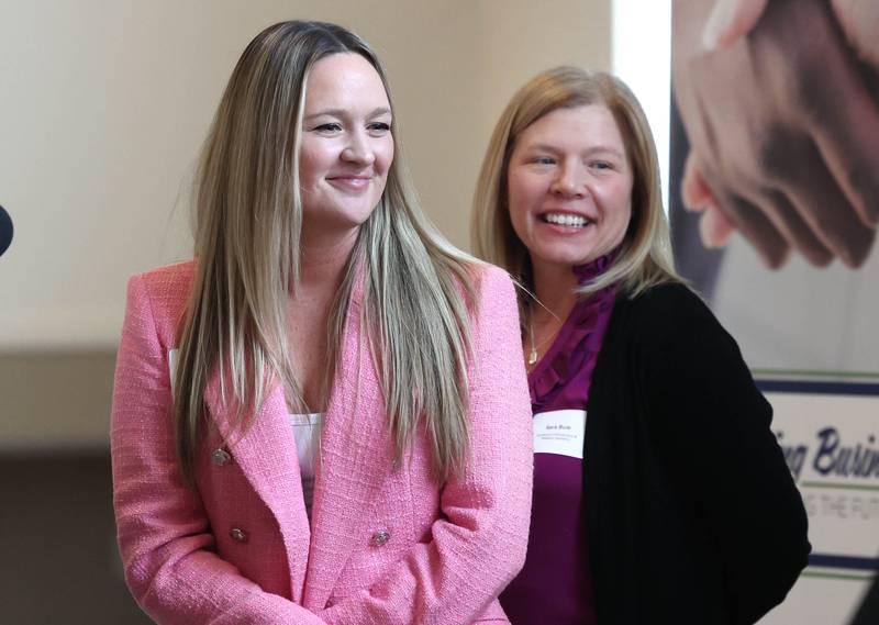 Heather Martines (left) and Sarah Buie accept the Spirit of Small Business Award on behalf of Sycamore Orthodontics and Pediatric Dentistry Thursday, March 5, 2026, during the Sycamore Chamber of Commerce Annual Meeting in Memorial Hall at St. Mary's Catholic Church in Sycamore.