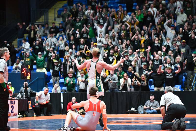 Cade Poyner of Coal City turns to celebrate with the crowd after his 190-pound match victory over Ross Miller of Vandalia during the IHSA Dual Team State Finals in Bloomington on Saturday, March 1.