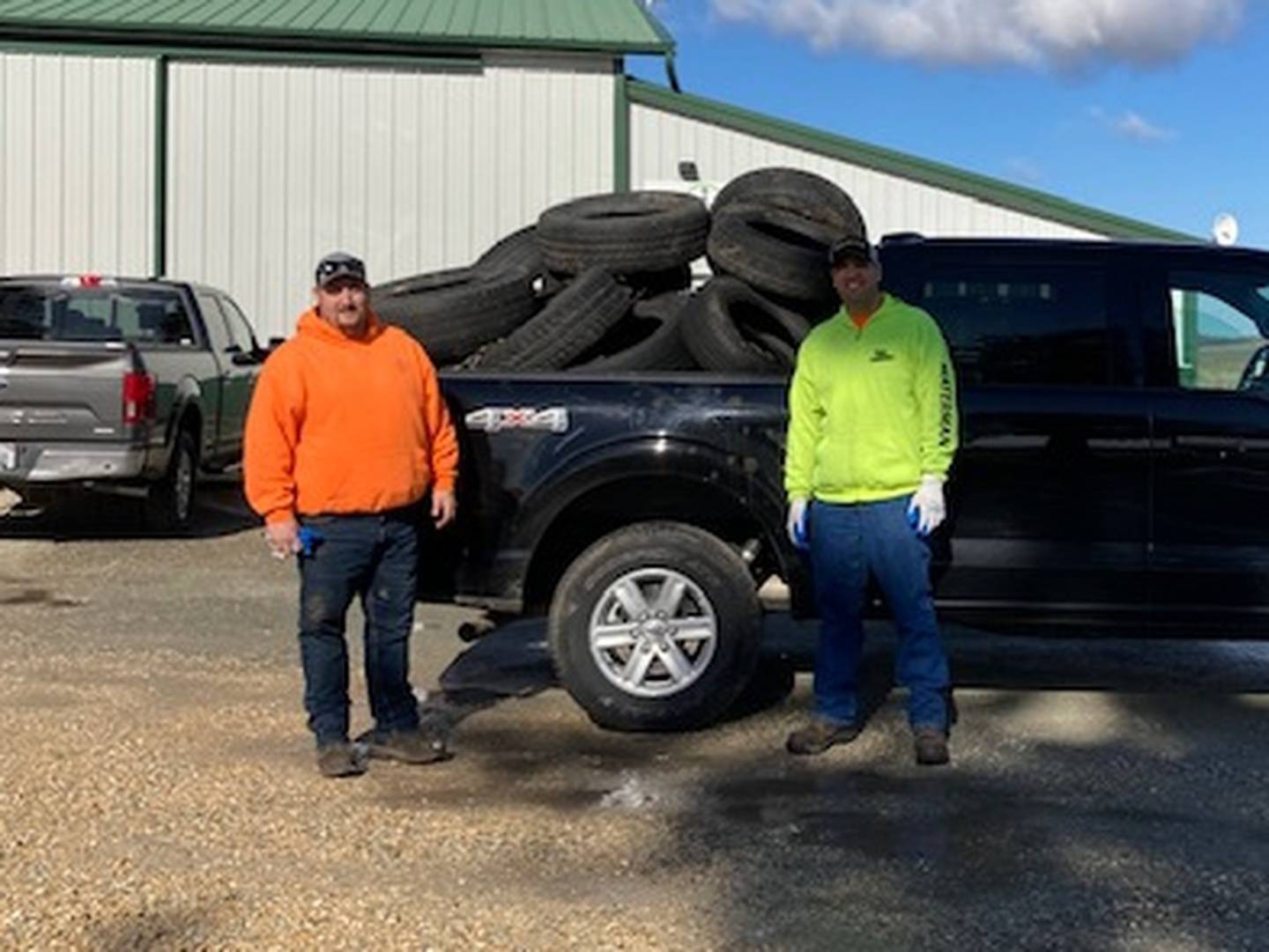 Pictured: Bayer Field Team members Charlie Hunter and Luke Phelps. The Bayer Field Team, based out of Rock Falls, is currently working to clean up discarded tires from ditches to help clean up the community during the summer. The main goal of the Bayer Field Team is to grow and produce high quality seed corn for Bayer in Bureau, Lee and Whiteside Counties. Bayer AG is a German multinational pharmaceutical and life sciences company which  provides tailored solutions for farmers to plant, grow and protect their harvests using less land, water and energy. Photo provided by Bayer Field Operations Coordinator Katie Draper.