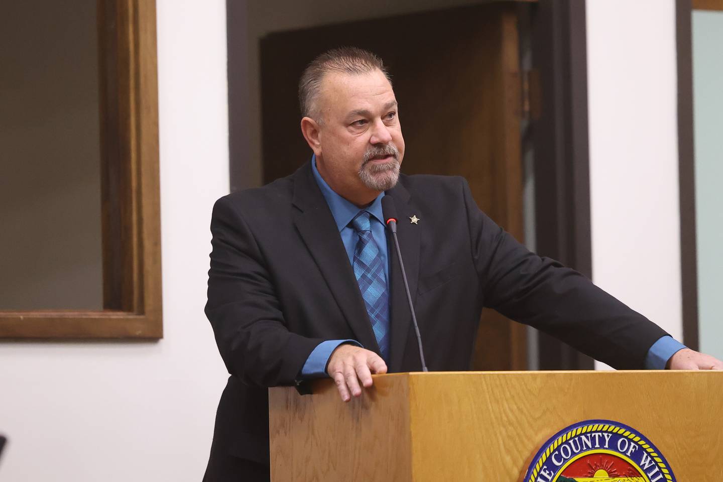 Will County Sheriff Mike Kelley shares a few words at his swearing-in ceremony at the Will County Building in Joliet on Thursday.