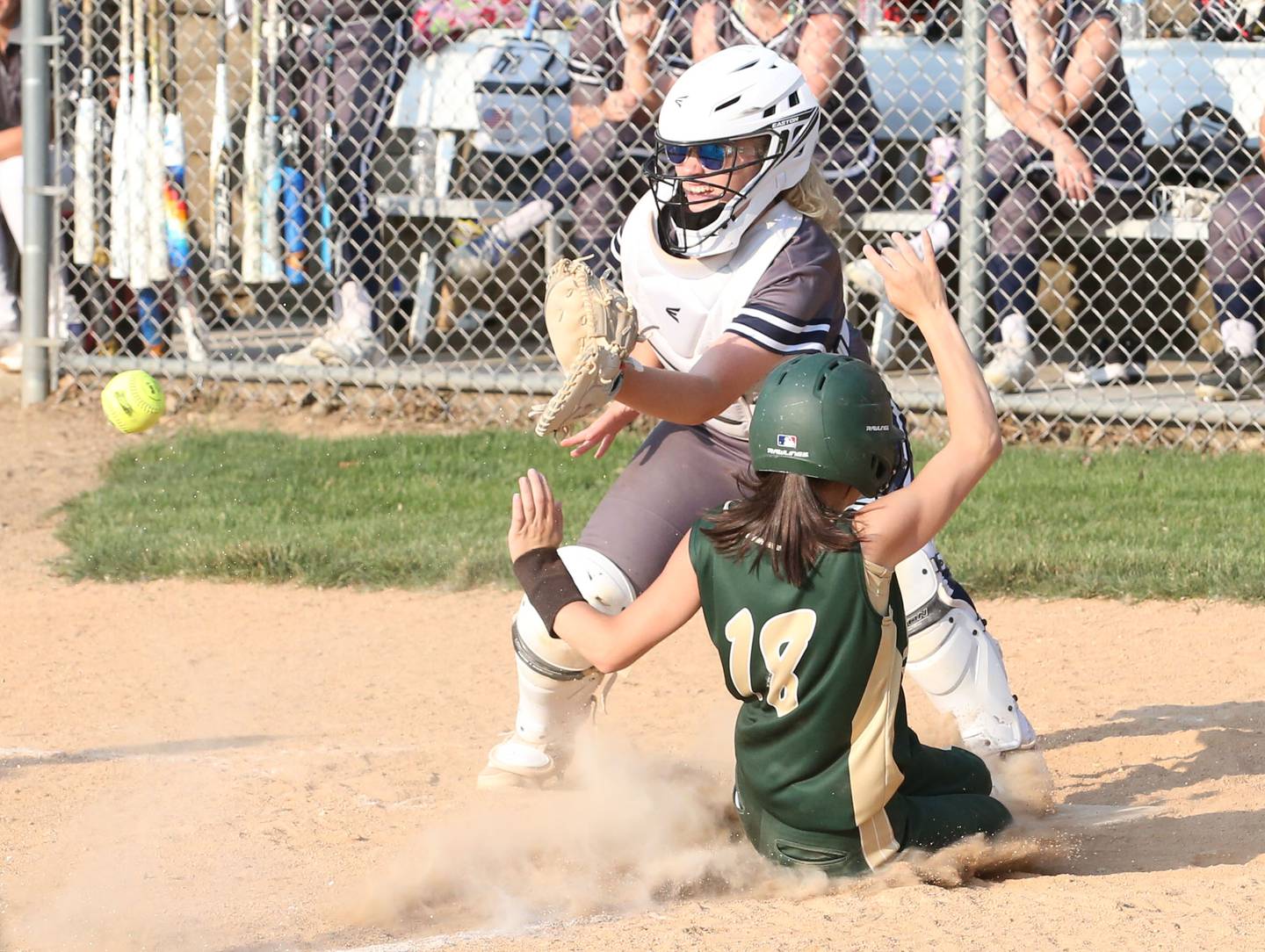 St. Bede's Bailey Engles scores a run as the throw comes in late to Ridgewood AlWood/Cambridge catcher Taylor Pace in the Class 1A Sectional semifinal game on Tuesday, May 23, 20223 at St. Bede Academy.