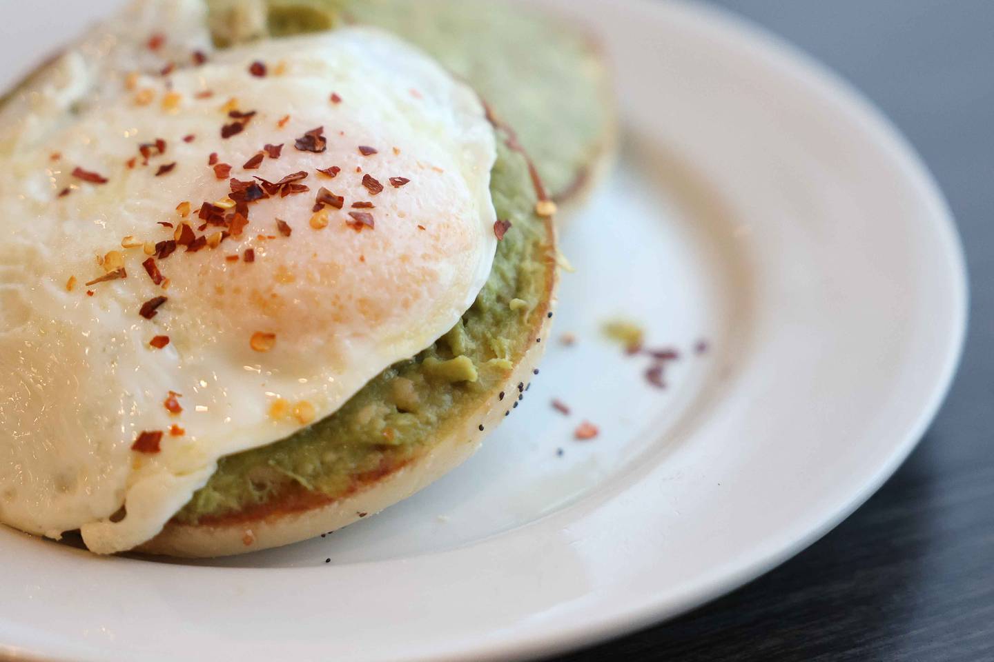 A plate of the Avocado Egg bagel sits on the table at Jitterhead on Wednesday, Dec. 11, 2024 in Crest Hill.
