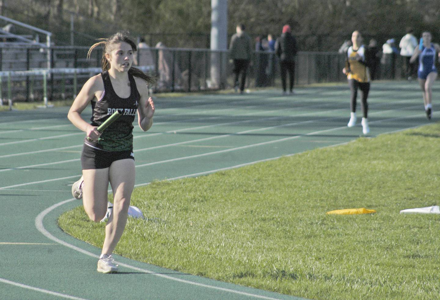 Rock Falls' Hana Ford runs the first lap of the girls 4x800 relay at the Rock Falls Rock Invite at Hinders Field on Friday, April 19, 2024.