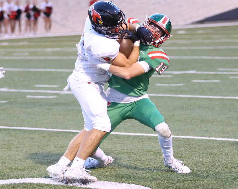 Metamora's Avery Grebner is met by L-P's Will Mertes on a play in the first quarter on Friday, Sept. 1, 2023 at Howard Fellows Stadium.