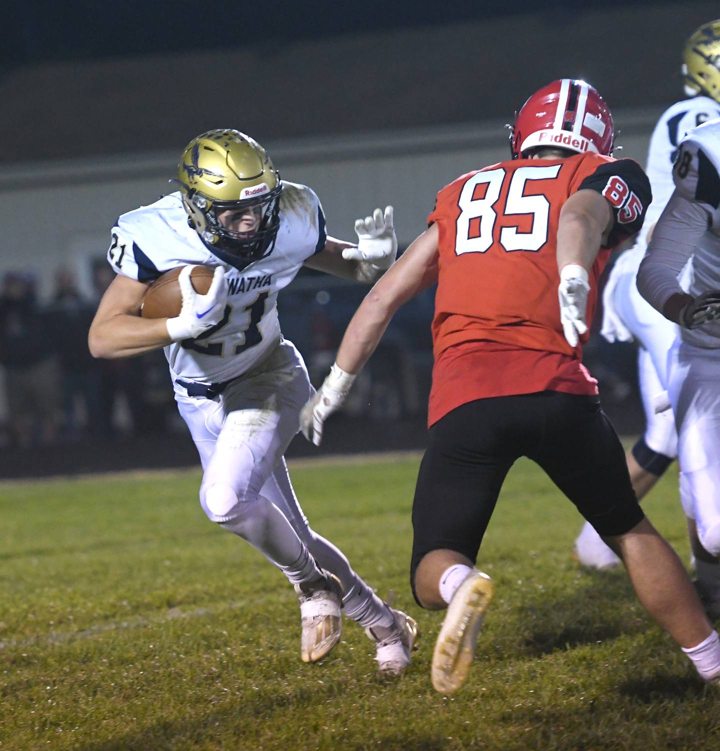 Hiawatha's Cole Brantley looks to avoid Amboy's Brennan Blaine during Friday. Sept 30 action in Amboy.