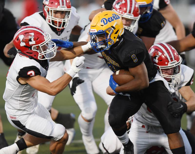 Joe Lewnard/jlewnard@dailyherald.com
Warren’s Aaron Stewart, right tries to get past Maine South’s Thomas Naughton during Thursday’s game in Gurnee.