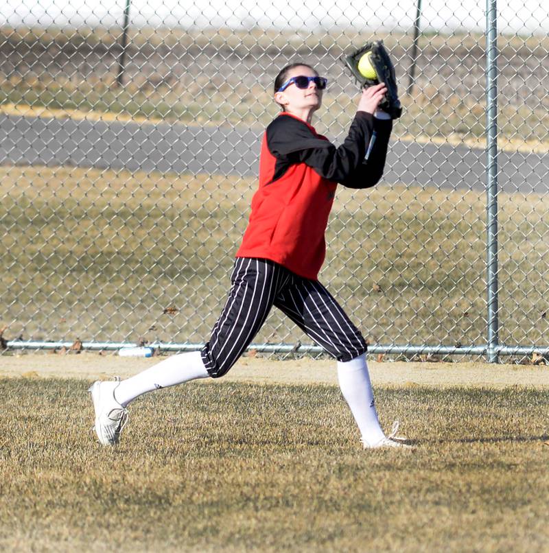 Forreston's Ayla Kiper catches a fly ball in centerfields during a game with River Ridge/Scales Mound on Monday, March 24, 2025 in Forreston.